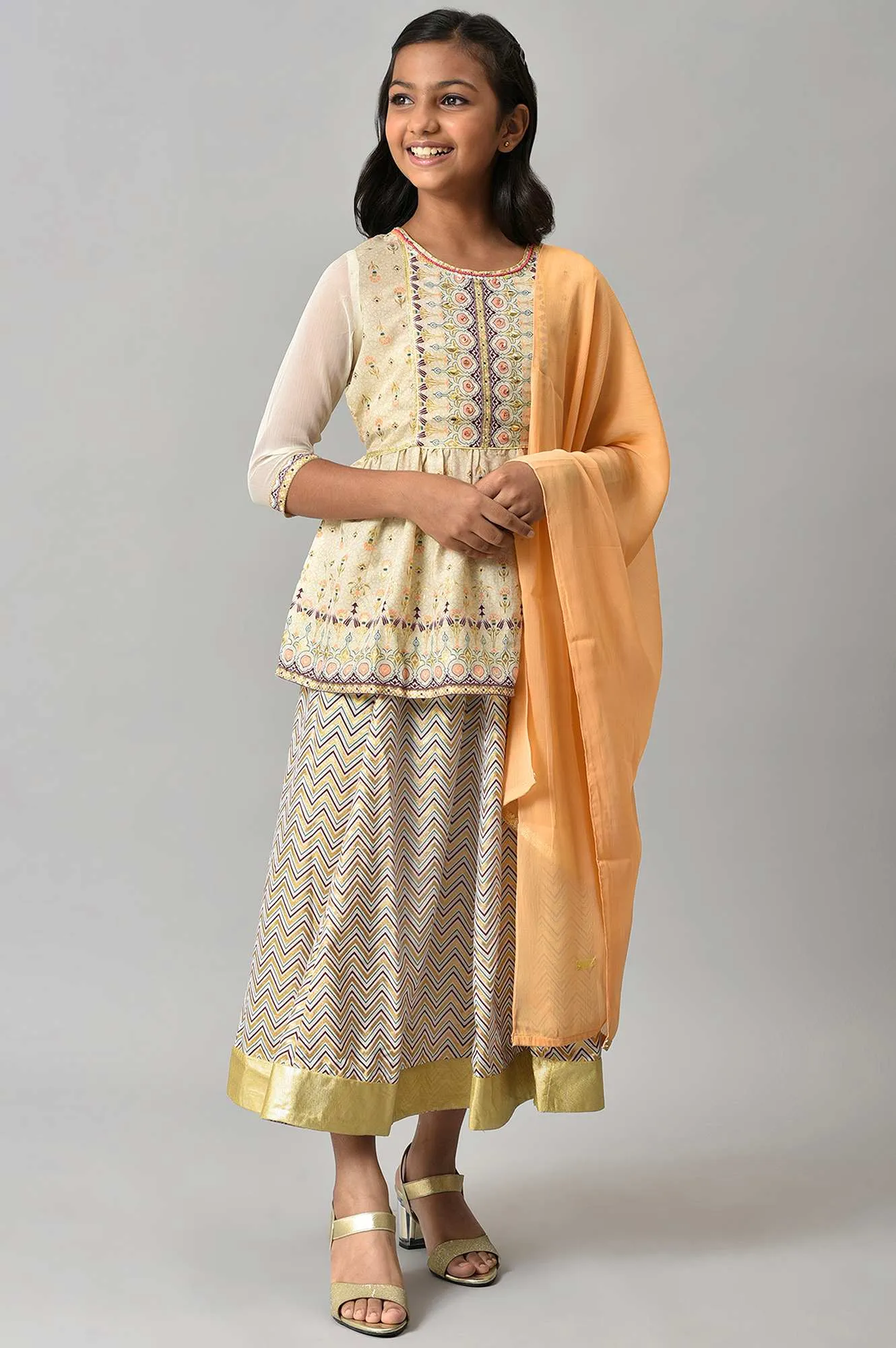 Girls Beige Floral Peplum Top With Skirt And Orange Dupatta