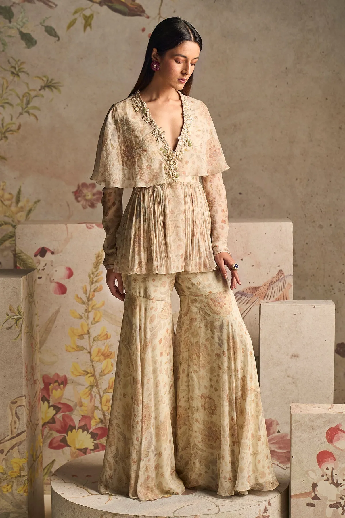 Pomp ivory peplum top and gharara