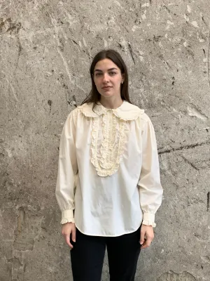 ruffled bib blouse