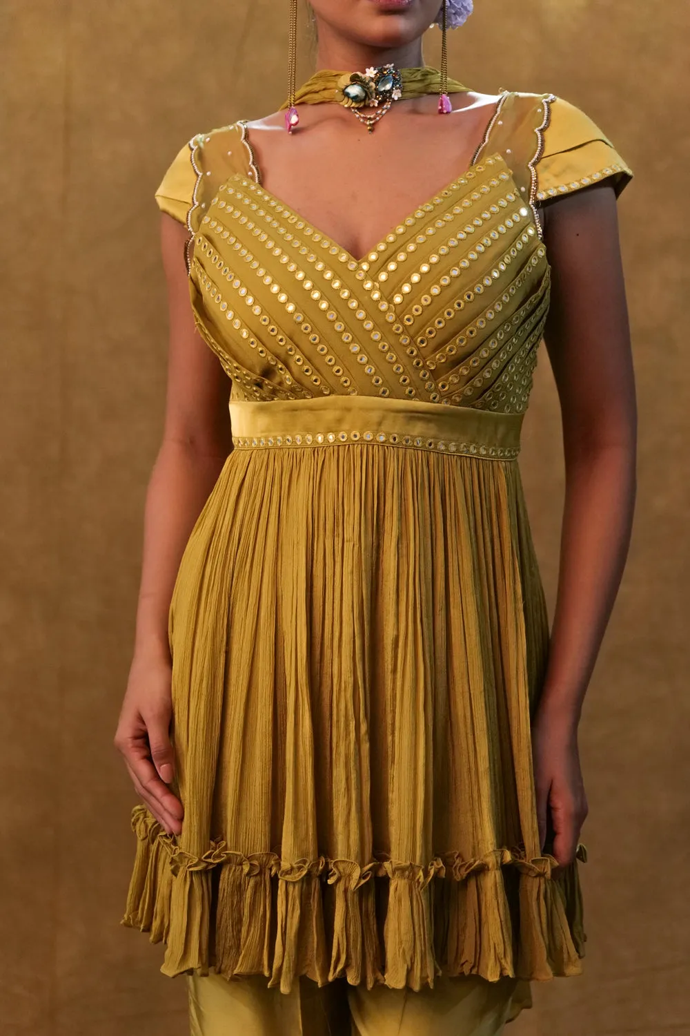 Sharara Set Paired With Flared Top And A Neck Dupatta.