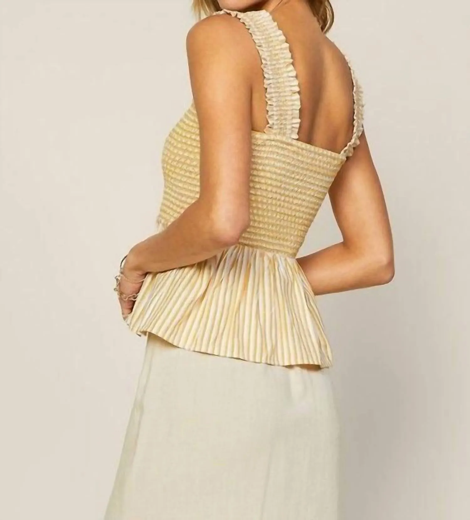 Striped Smocked Peplum Top In Yellow