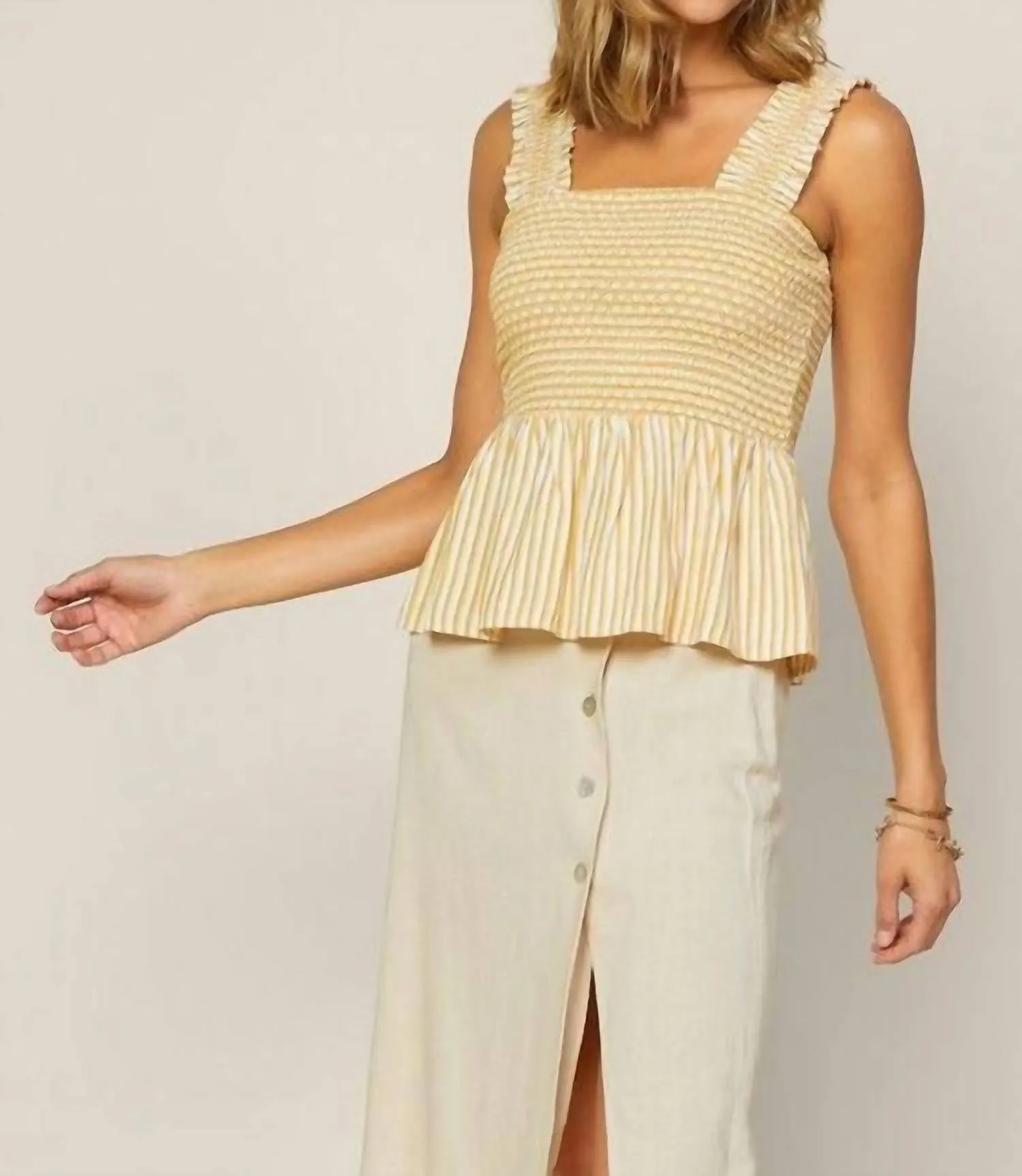 Striped Smocked Peplum Top In Yellow