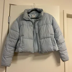 Urban Outfitters cropped light blue puffer coat
